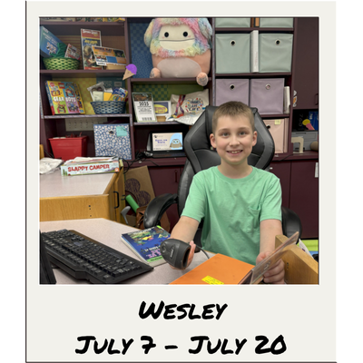 Nesmith Library's 2025 Kid Librarian: Wesley, featuring a picture of Wesley scanning a book's barcode at the library children's circulation desk.