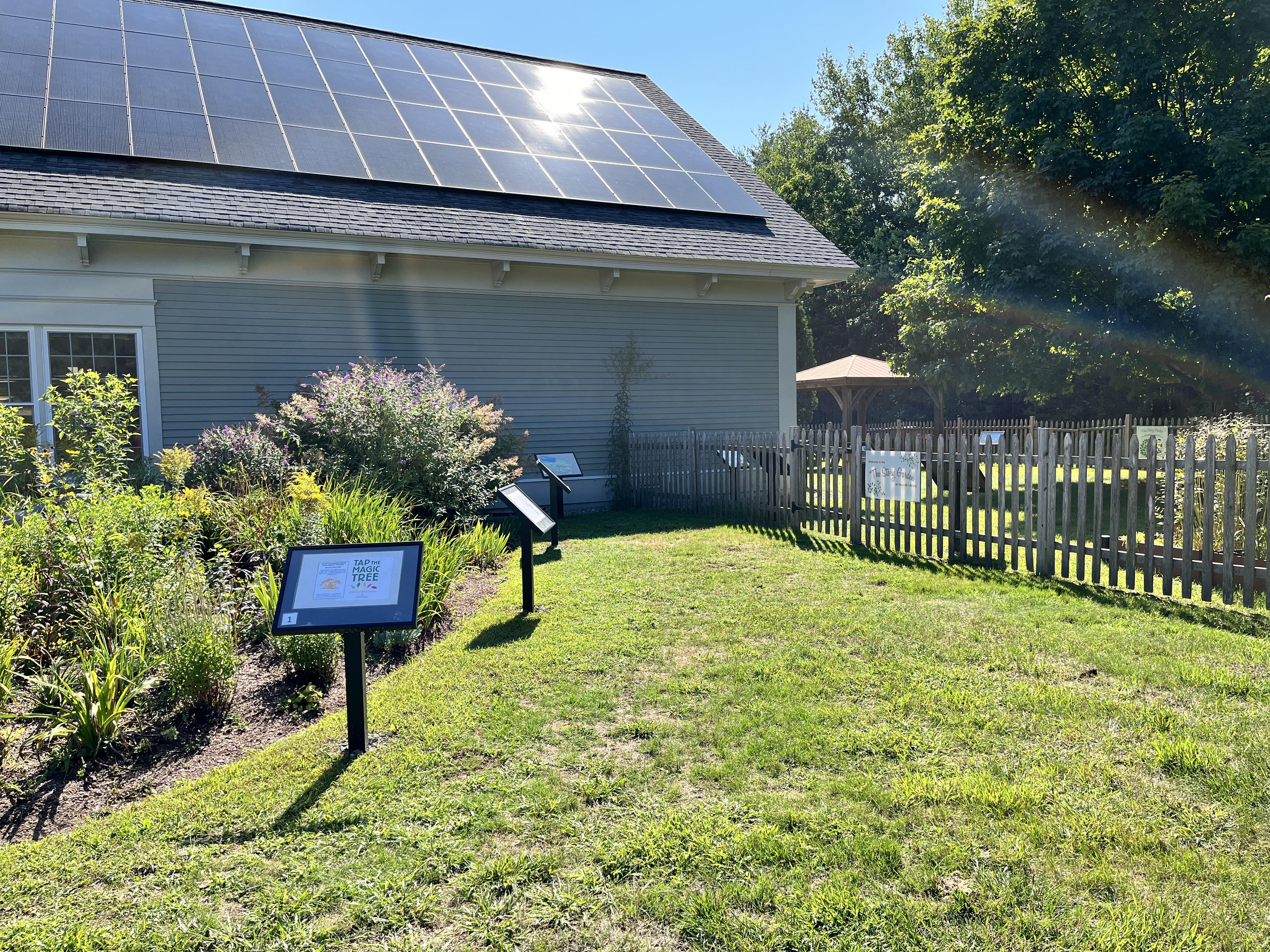 Entrance to the storygarden, with the storywalk displays leading into the garden.